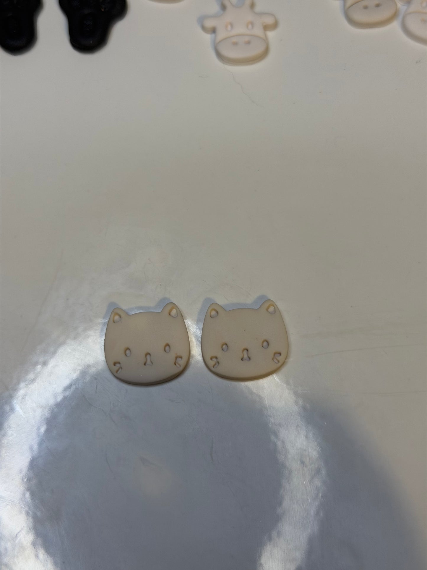 Cat face studs