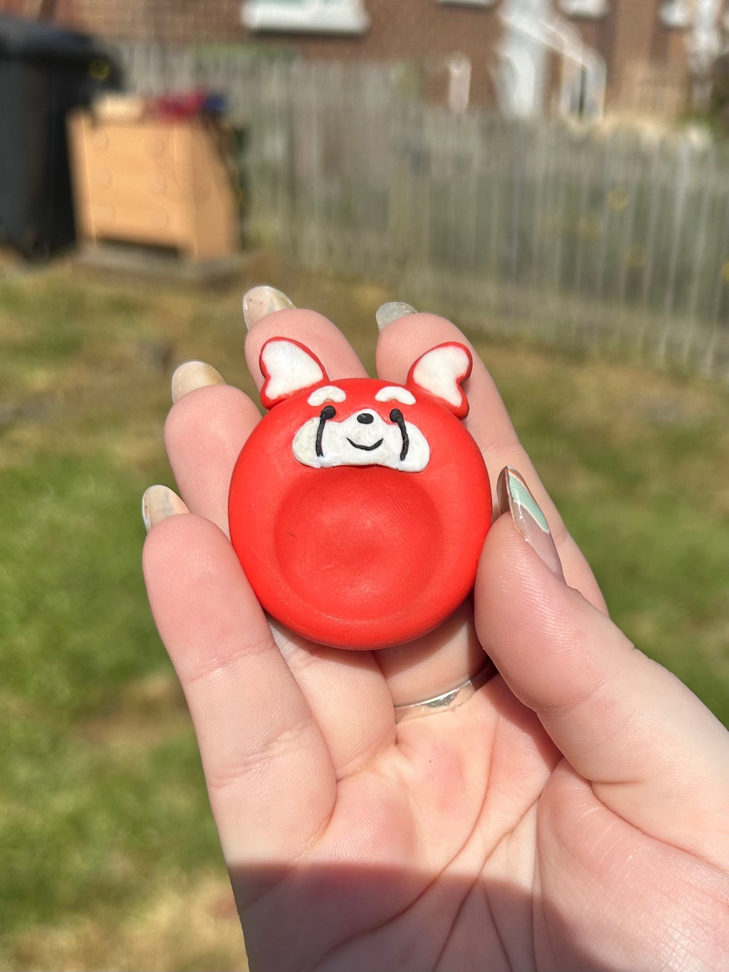 Red panda thumb stone