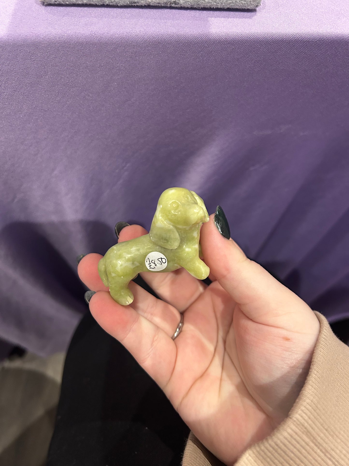 Serpentine dog carving