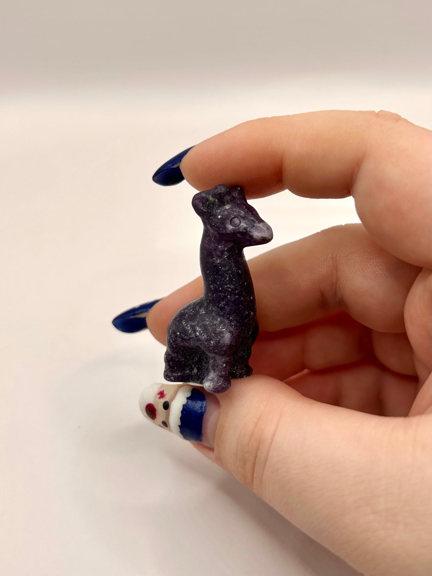 Lepidolite llama carving