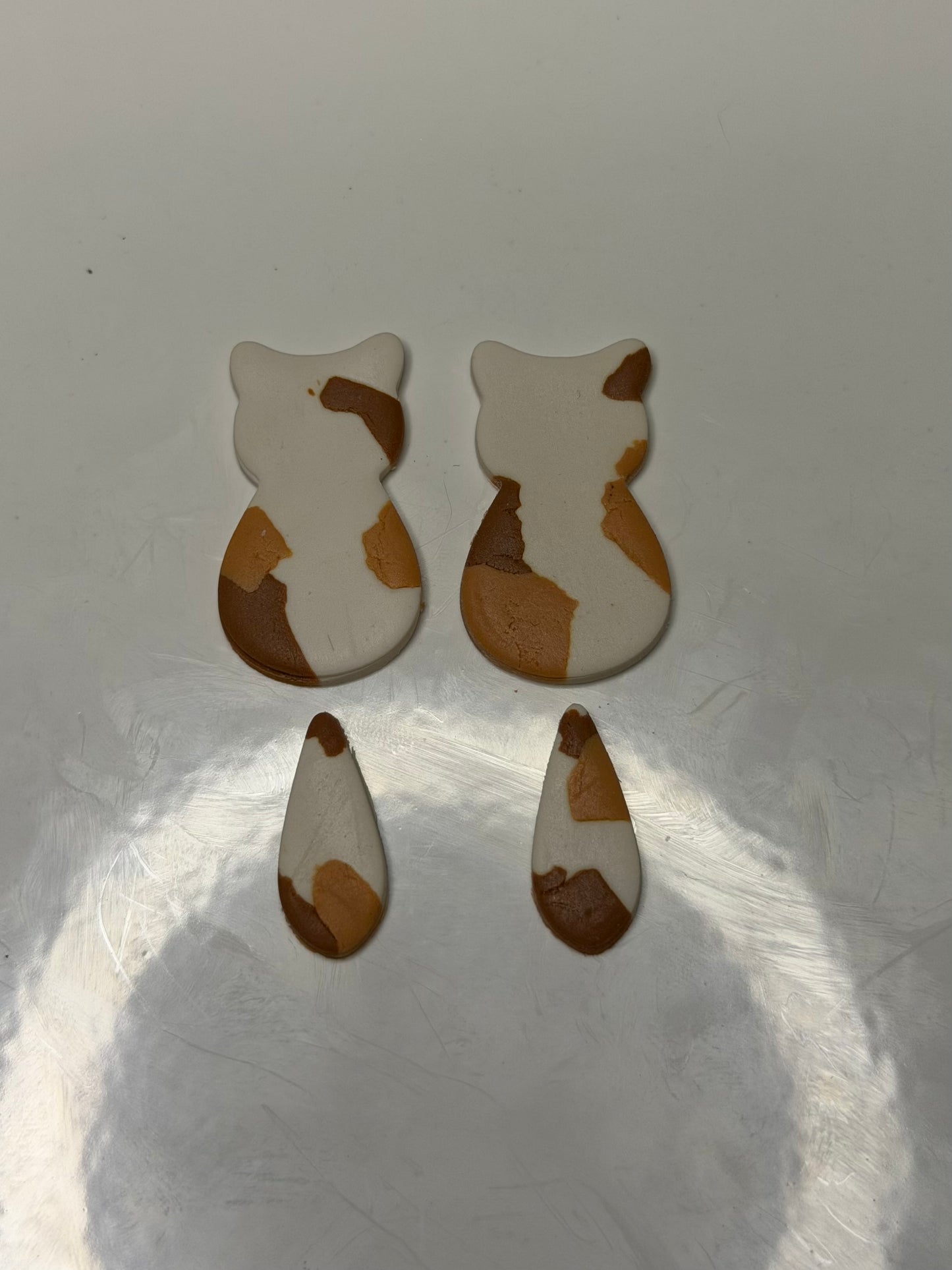 Calico cat silhouette earrings ￼