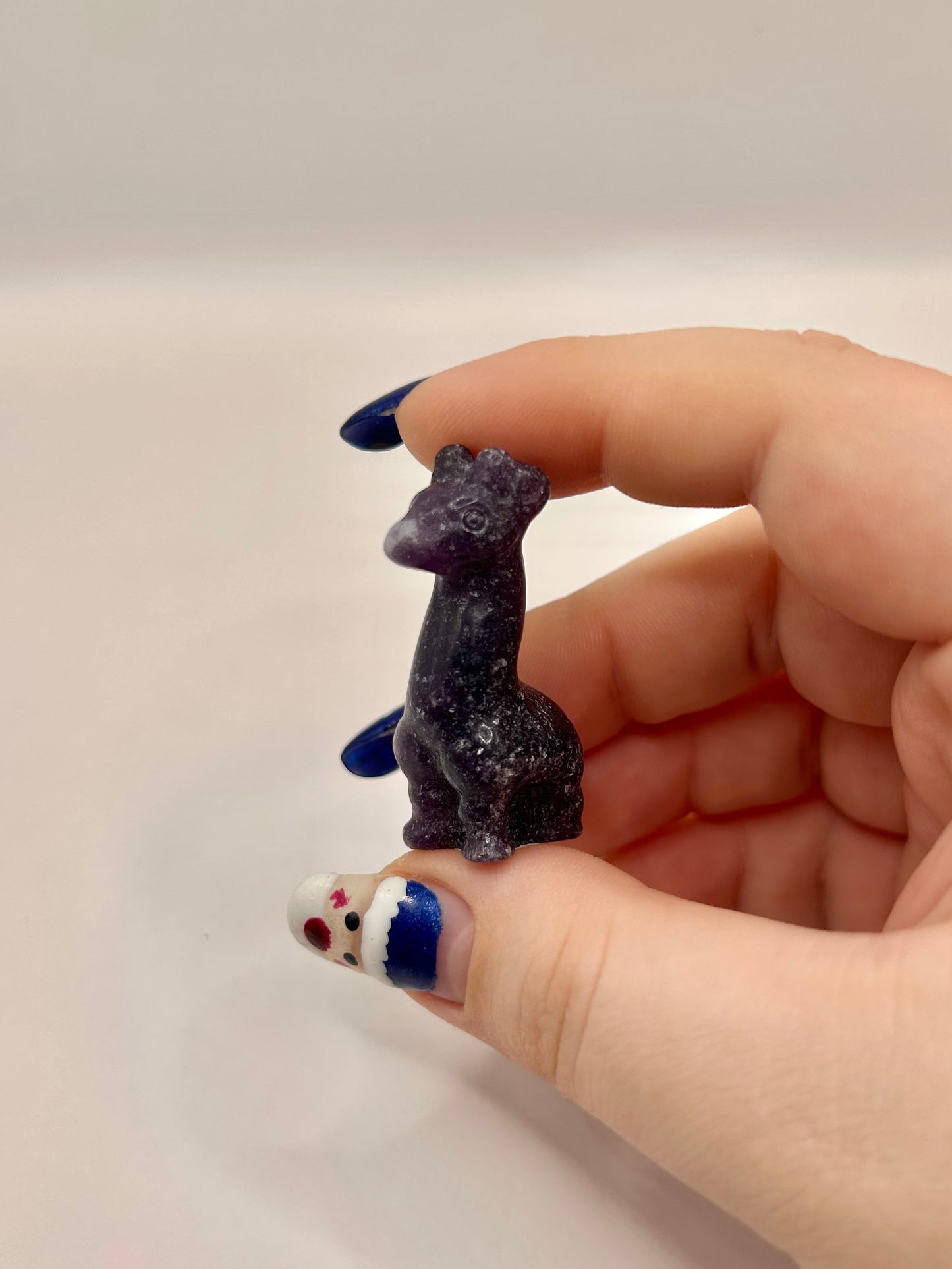Lepidolite llama carving