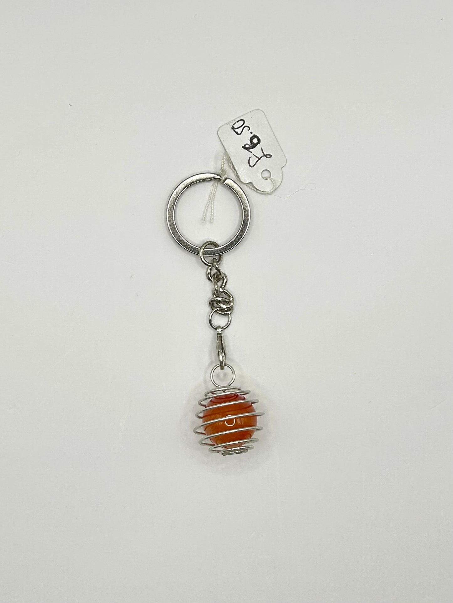 Interchangeable crystal cage keyrings