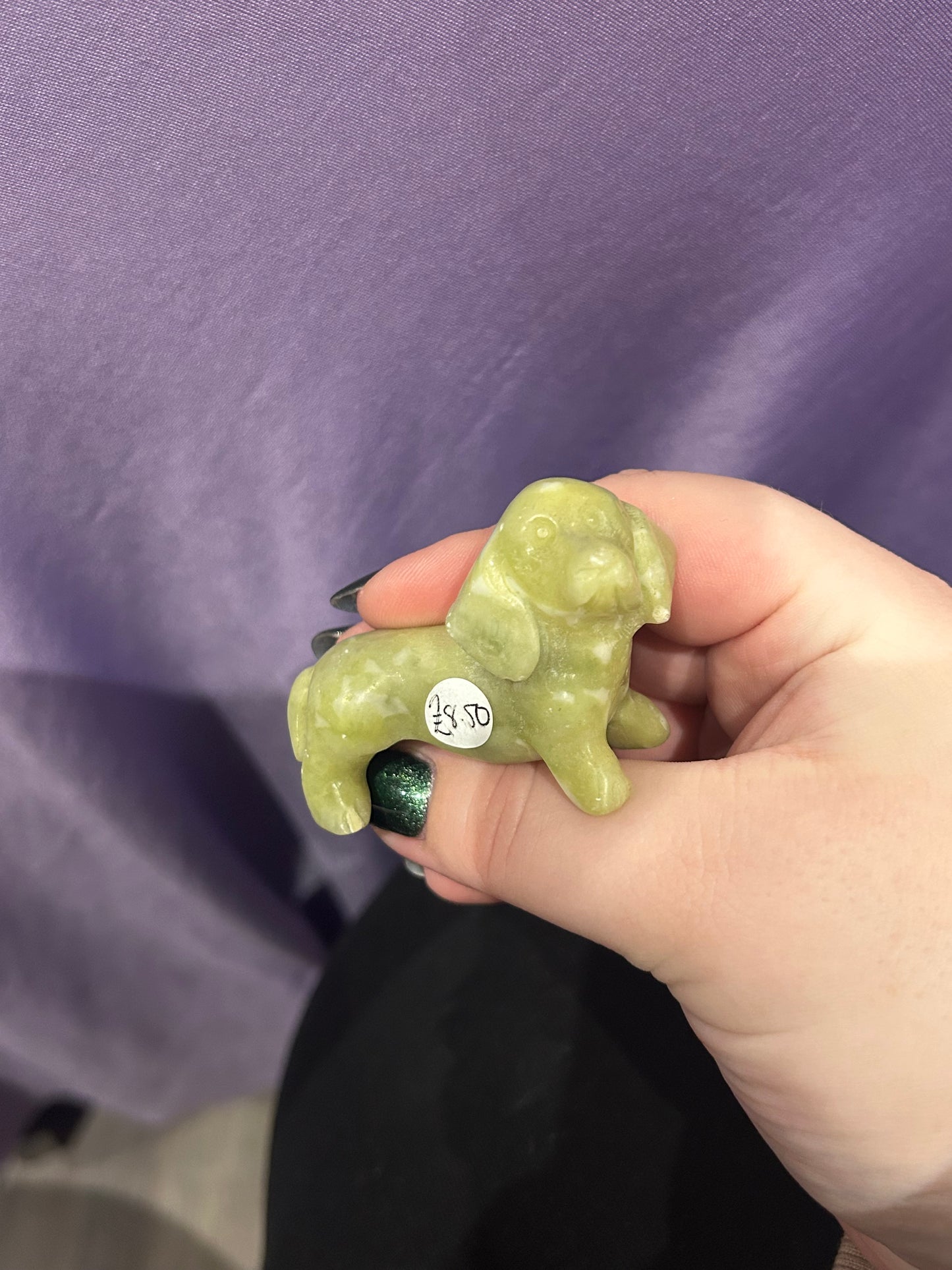 Serpentine dog carving