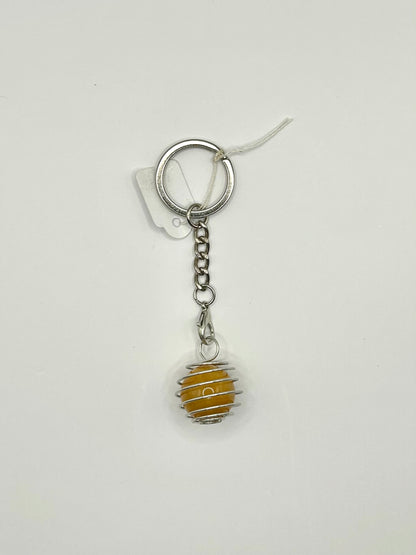 Interchangeable crystal cage keyrings